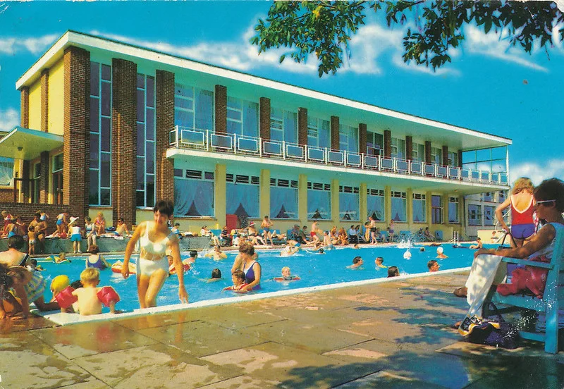 1970s postcard of Pontins south Devon holiday camp showing the swimming pool and main building