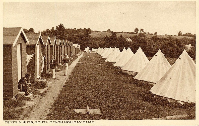 1930s postcard of South Devon holiday camp showing tents and huts
