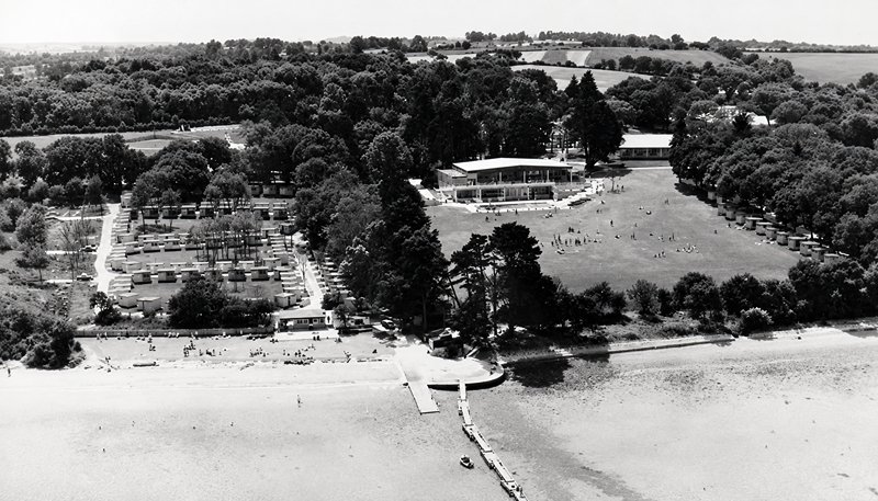 postcard of Warner's woodside bay holiday camp showing an aerial view