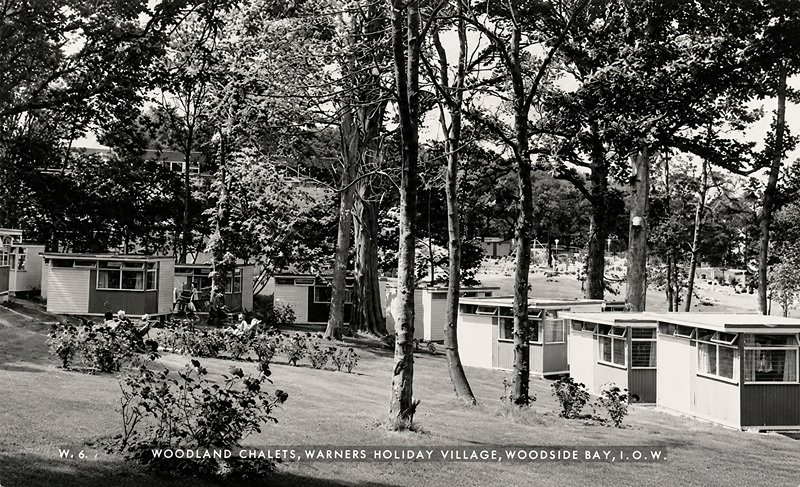 postcard of Warner's woodside bay holiday camp showing chalets