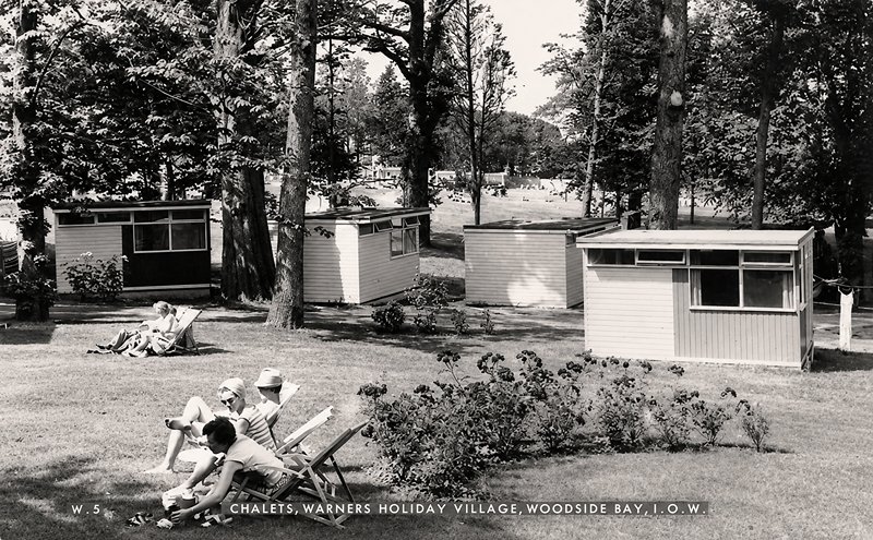 postcard of Warner's woodside bay holiday camp showing chalets