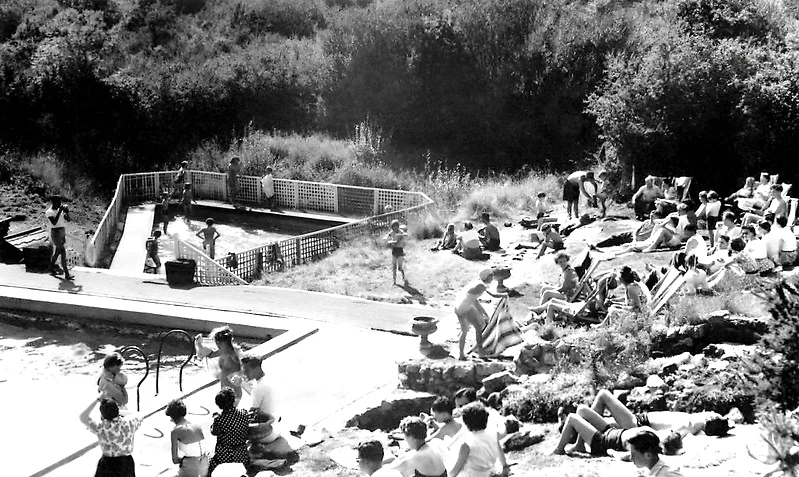 sunbathers beside swimming pool at Little Canada Holiday camp 1950s