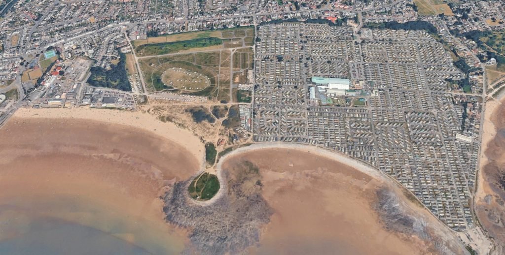 aerial view of Porthcawl showing Coney Beach on the left, the arena in the middle and Trecco Bay to the right