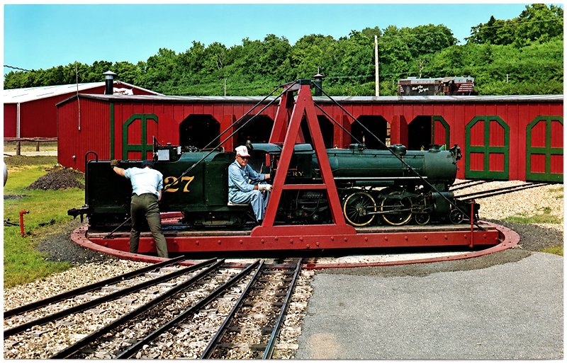 127 being turned at the roundhouse in All America Park, Quincy. The antique auto museum can be seen in the background
