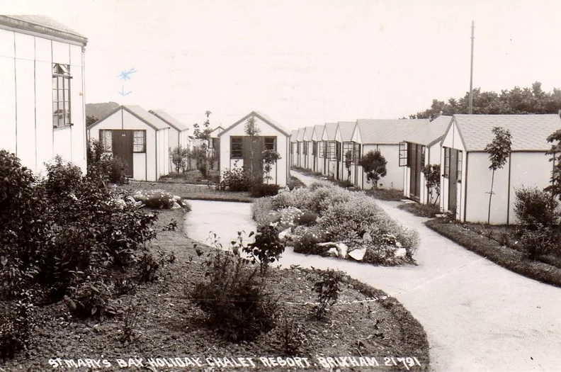 St Marys Bay vintage postcard, Brixham 1950s showing lines of chalets