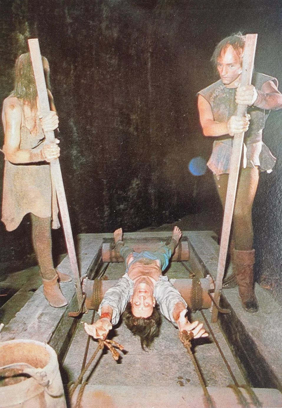 Old postcard showing one of the torture devices at the London Dungeon